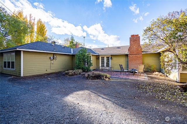 rear view of house featuring a patio