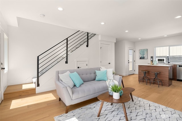 living room with light hardwood / wood-style floors