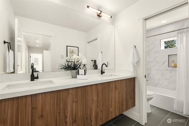 full bathroom with vanity, toilet, tile patterned floors, and shower / tub combo