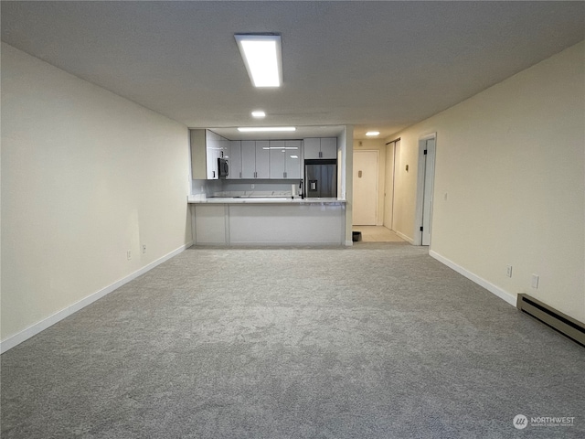 unfurnished living room with light colored carpet