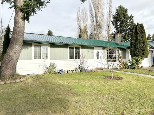 ranch-style house with a front lawn