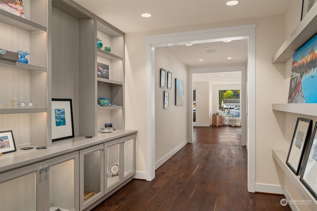 corridor featuring dark hardwood / wood-style flooring