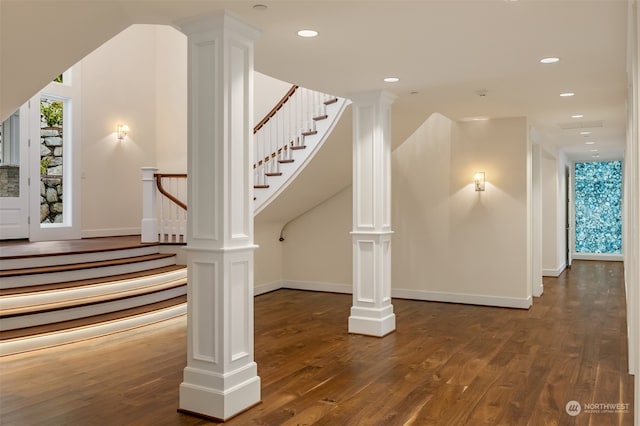 stairway with hardwood / wood-style flooring