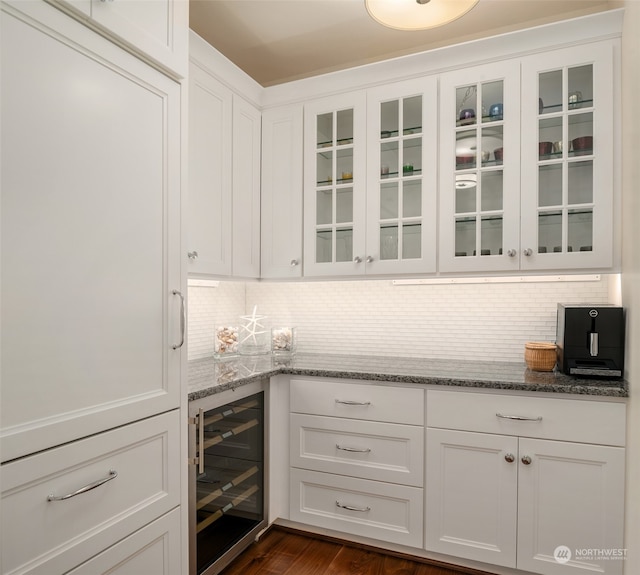 bar featuring white cabinets and beverage cooler