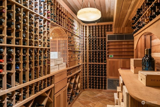 wine room with wood ceiling