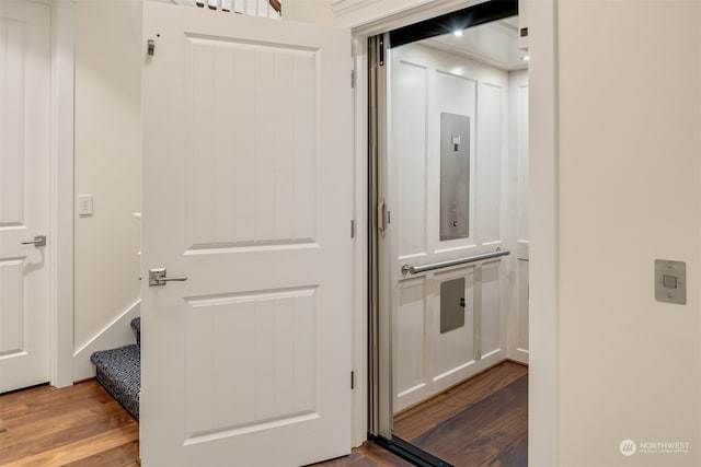 interior space featuring hardwood / wood-style floors and elevator