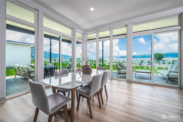 sunroom featuring a mountain view