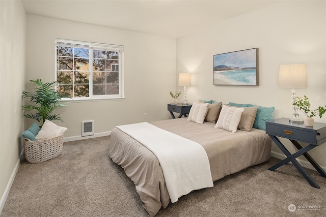 bedroom with carpet flooring and heating unit