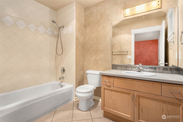 full bathroom with vanity, tiled shower / bath, toilet, and tile patterned floors