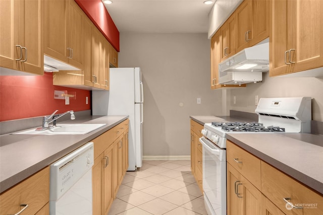 kitchen featuring sink, white appliances, and light tile patterned floors