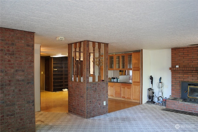 kitchen with carpet floors and a textured ceiling