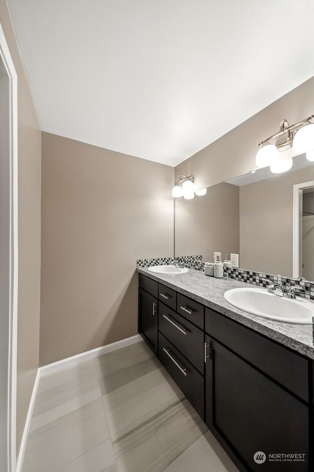 bathroom with tile patterned floors and vanity