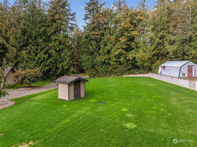 37122 237th Pl SE, Enumclaw, WA 98022 - view of green lawn featuring a storage unit