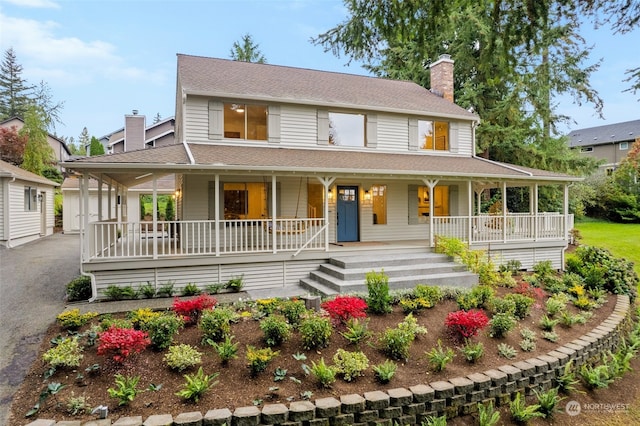 farmhouse inspired home with a porch