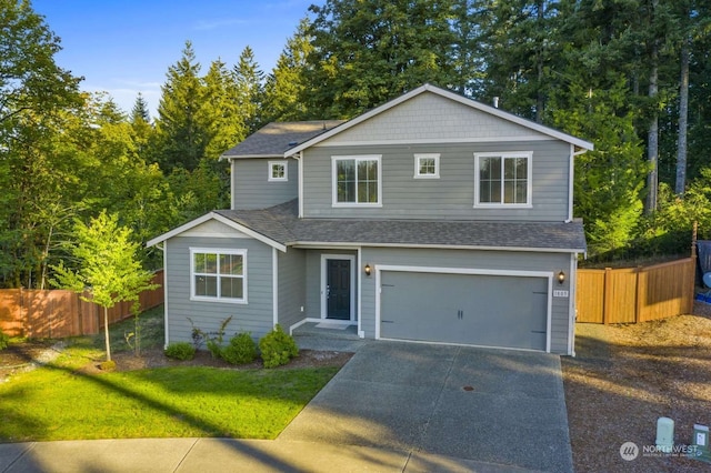 view of front property with a garage and a front lawn