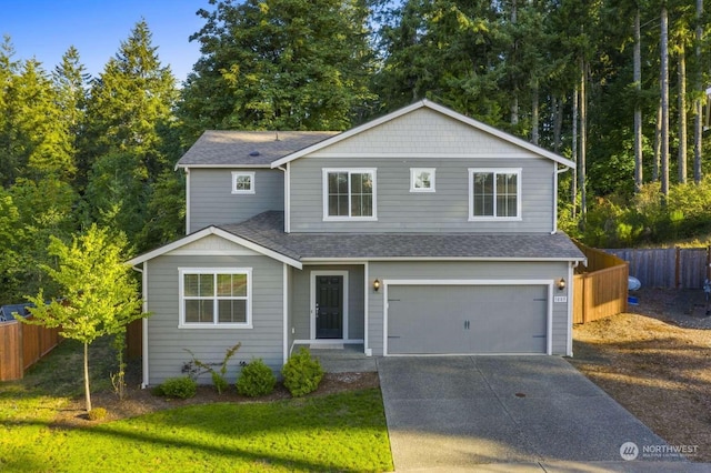 front of property featuring a garage and a front lawn