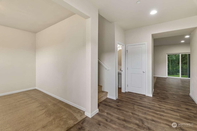 stairs featuring hardwood / wood-style flooring