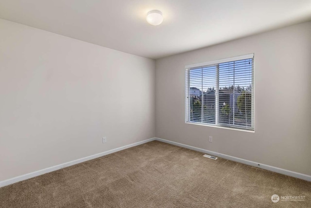 view of carpeted spare room