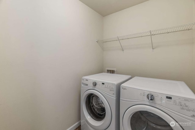 laundry room with separate washer and dryer