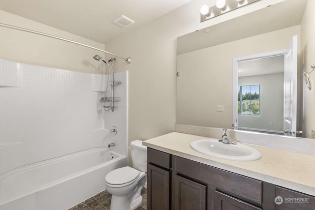 full bathroom with vanity, bathing tub / shower combination, and toilet