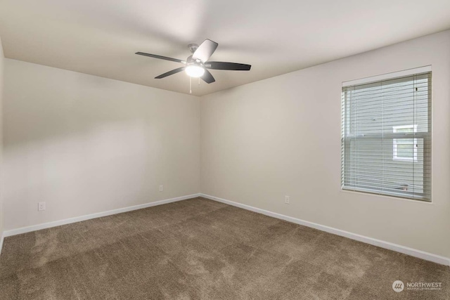 carpeted empty room featuring ceiling fan