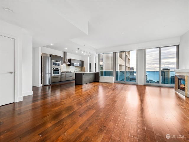 unfurnished living room featuring wood-type flooring