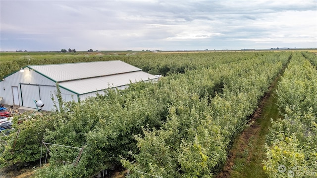 birds eye view of property featuring a rural view