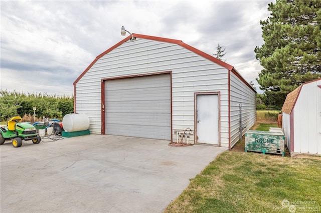 garage with a yard