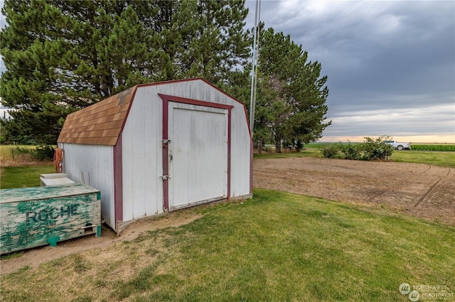 view of outdoor structure with a yard