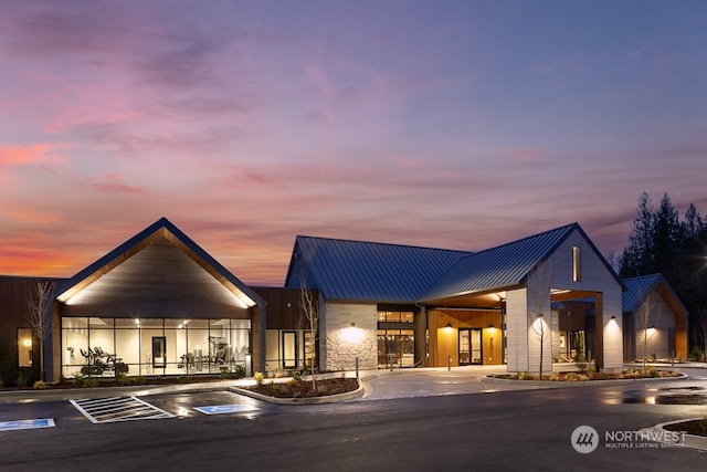 view of outdoor building at dusk