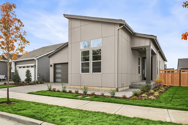 view of side of property with a garage and a yard