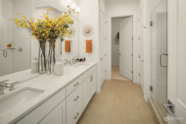 bathroom featuring an enclosed shower and vanity