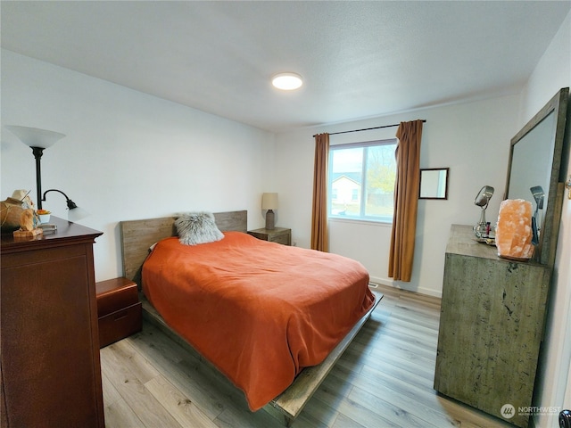 bedroom with light wood-type flooring