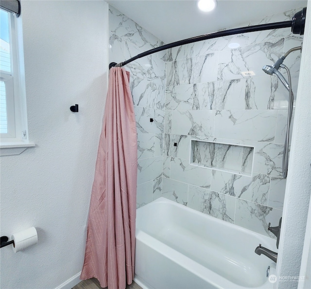 bathroom featuring shower / tub combo