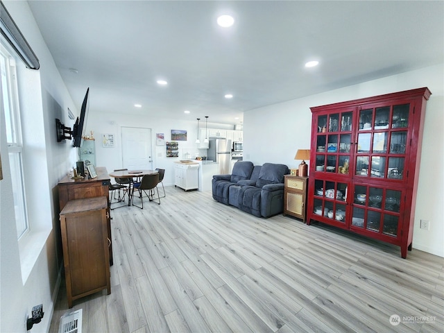 living room with light hardwood / wood-style floors