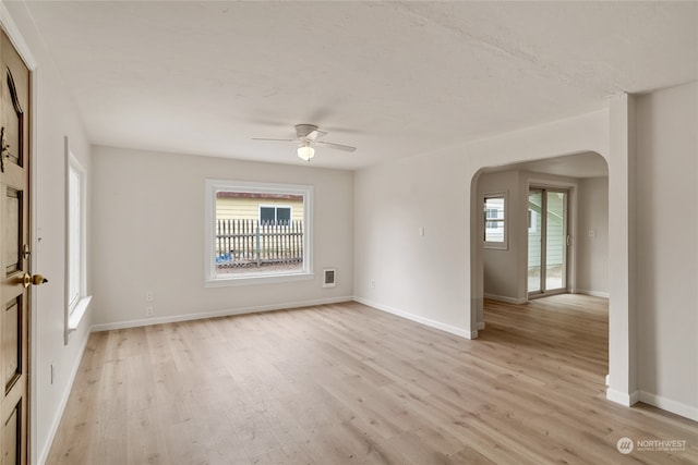 empty room featuring light hardwood / wood-style floors and ceiling fan