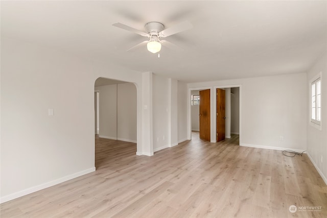 unfurnished room featuring light wood-type flooring and ceiling fan