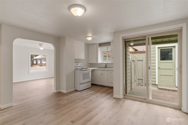 kitchen with sink, white cabinetry, light hardwood / wood-style floors, ceiling fan, and white range with electric stovetop