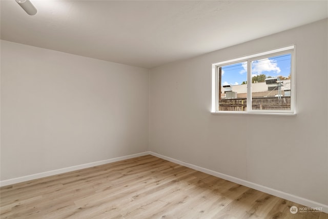 empty room with light hardwood / wood-style floors