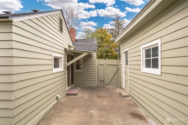 view of property exterior with a patio