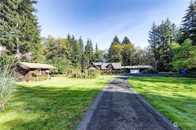 107 Dowans Creek Rd, Forks, WA 98331 - view of front of property with a front lawn, driveway, and a chimney