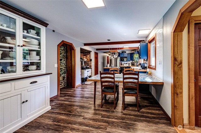107 Dowans Creek Rd, Forks, WA 98331 - dining room with dark wood-style flooring and baseboards