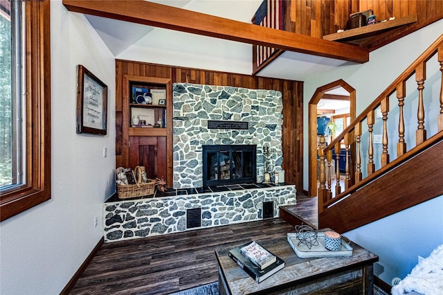 107 Dowans Creek Rd, Forks, WA 98331 - living room with a stone fireplace, wood finished floors, baseboards, and stairs
