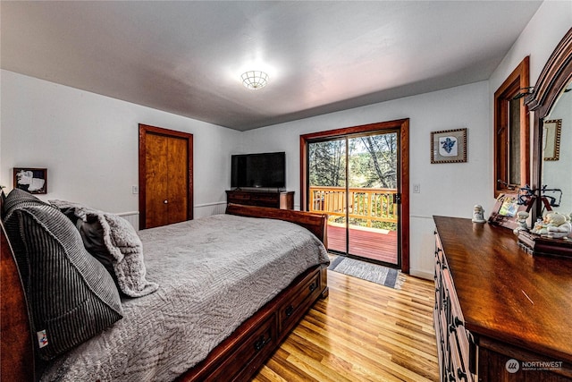 107 Dowans Creek Rd, Forks, WA 98331 - bedroom with access to outside, light wood-style flooring, and baseboards