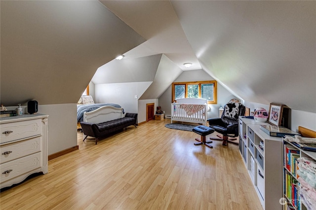 107 Dowans Creek Rd, Forks, WA 98331 - bedroom featuring light wood finished floors, vaulted ceiling, and baseboards