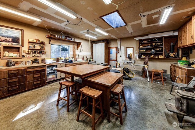 107 Dowans Creek Rd, Forks, WA 98331 - dining space featuring a workshop area and concrete floors