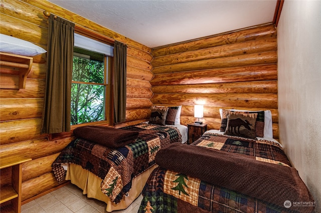 bedroom featuring log walls