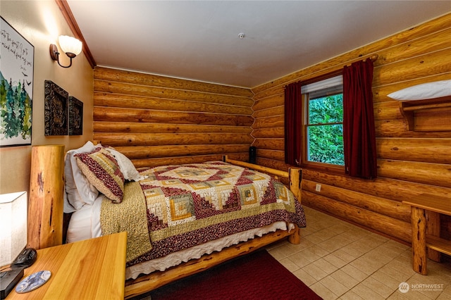 bedroom featuring log walls