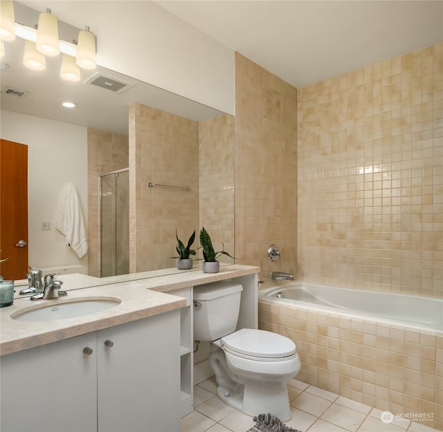 bathroom with vanity, toilet, and tile patterned floors