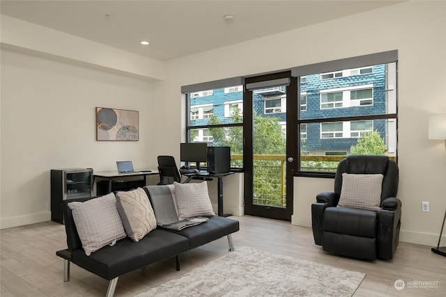 sitting room featuring light hardwood / wood-style floors and a wealth of natural light